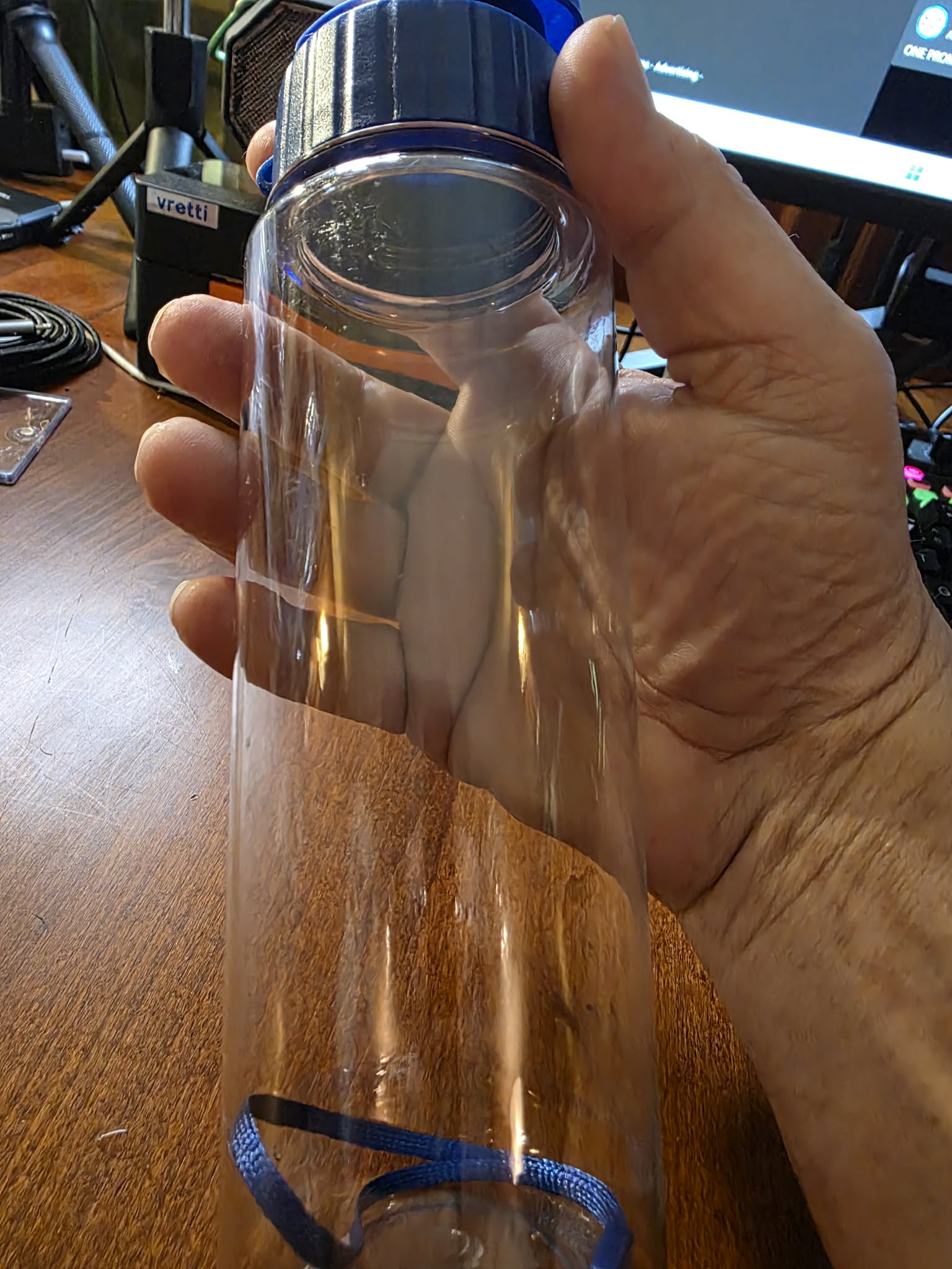Clear Portable Water Bottle with Blue Lid
